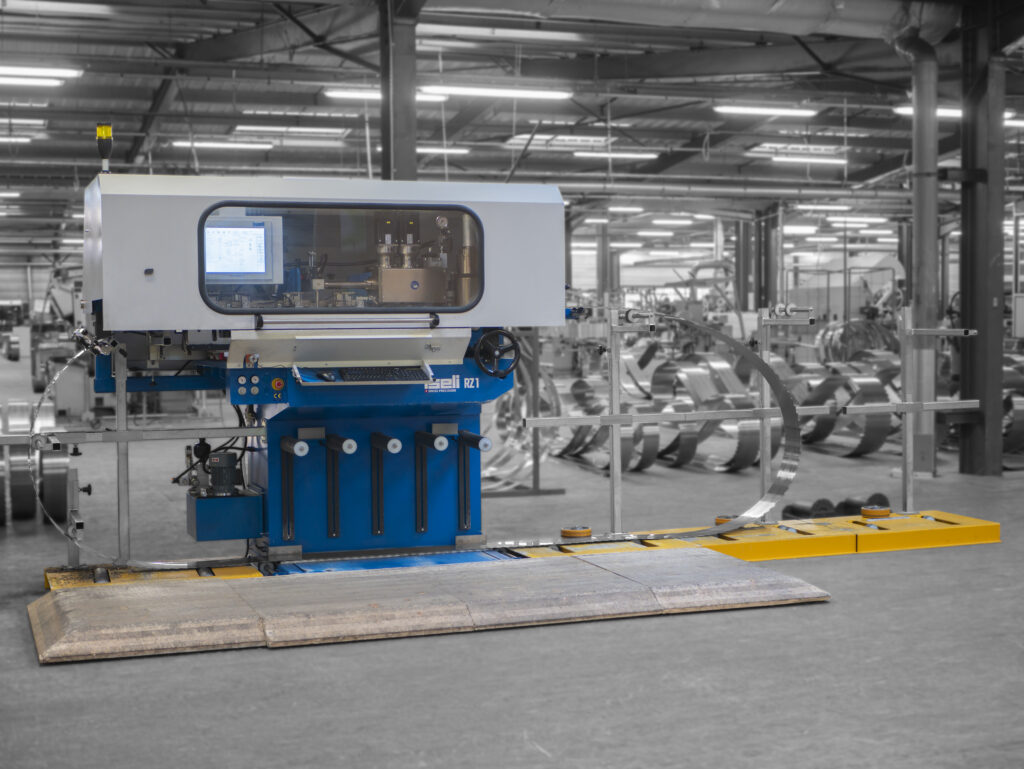 Iseli RZ1 CNC sharpening machine in operation at a saw blade production plant.